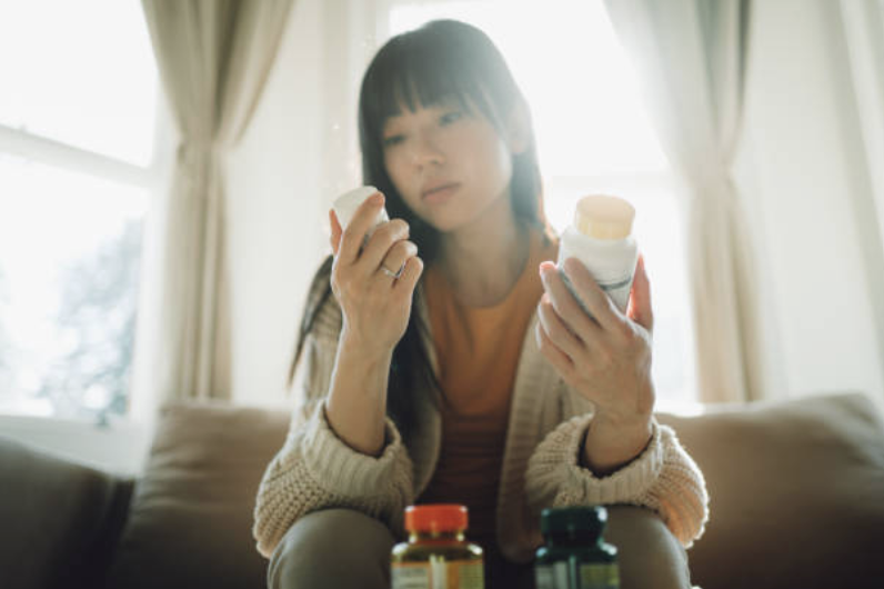 Person self-injecting semaglutide medication into abdomen